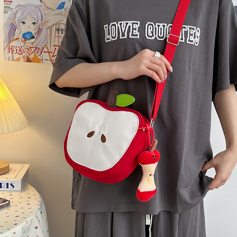 A multi-purpose red apple KT cat shoulder bag