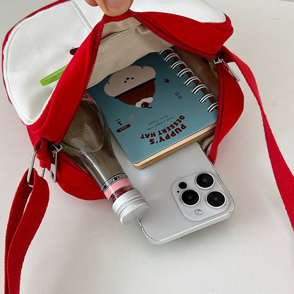 A multi-purpose red apple KT cat shoulder bag