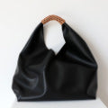Spliced woven shoulder bag