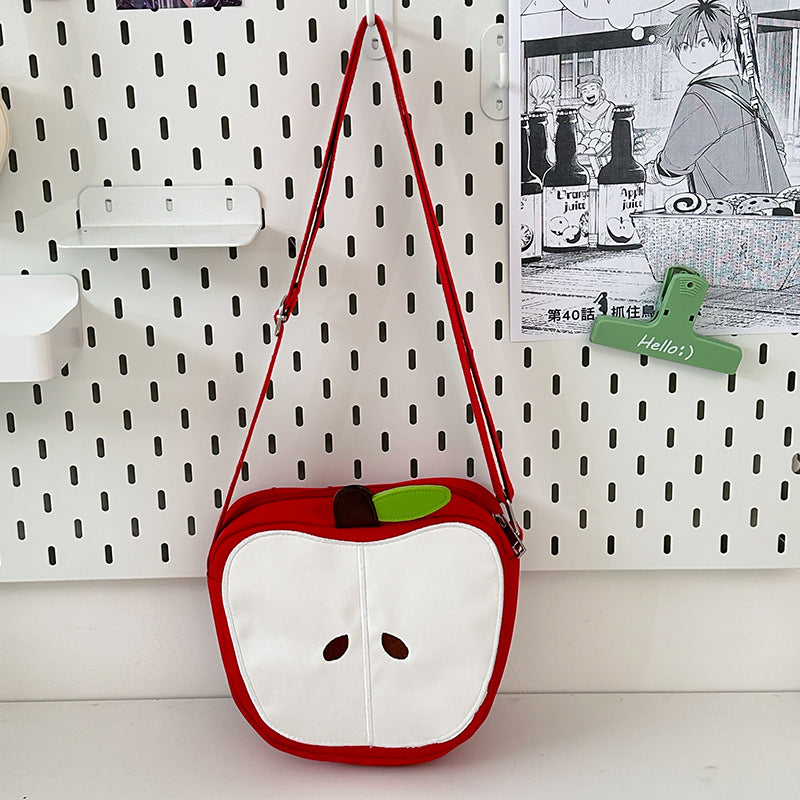 A multi-purpose red apple KT cat shoulder bag